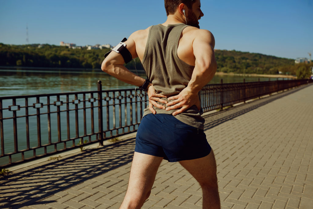 Canva Jogger Holding His Back x